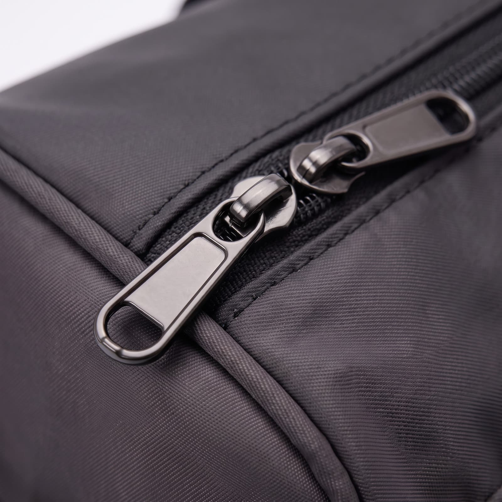 Close-up of the zipper pull on The Original in Matte Black